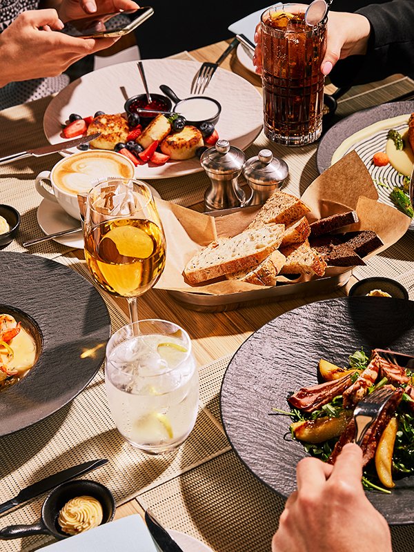 Restaurant table of food , friends and hospitality.